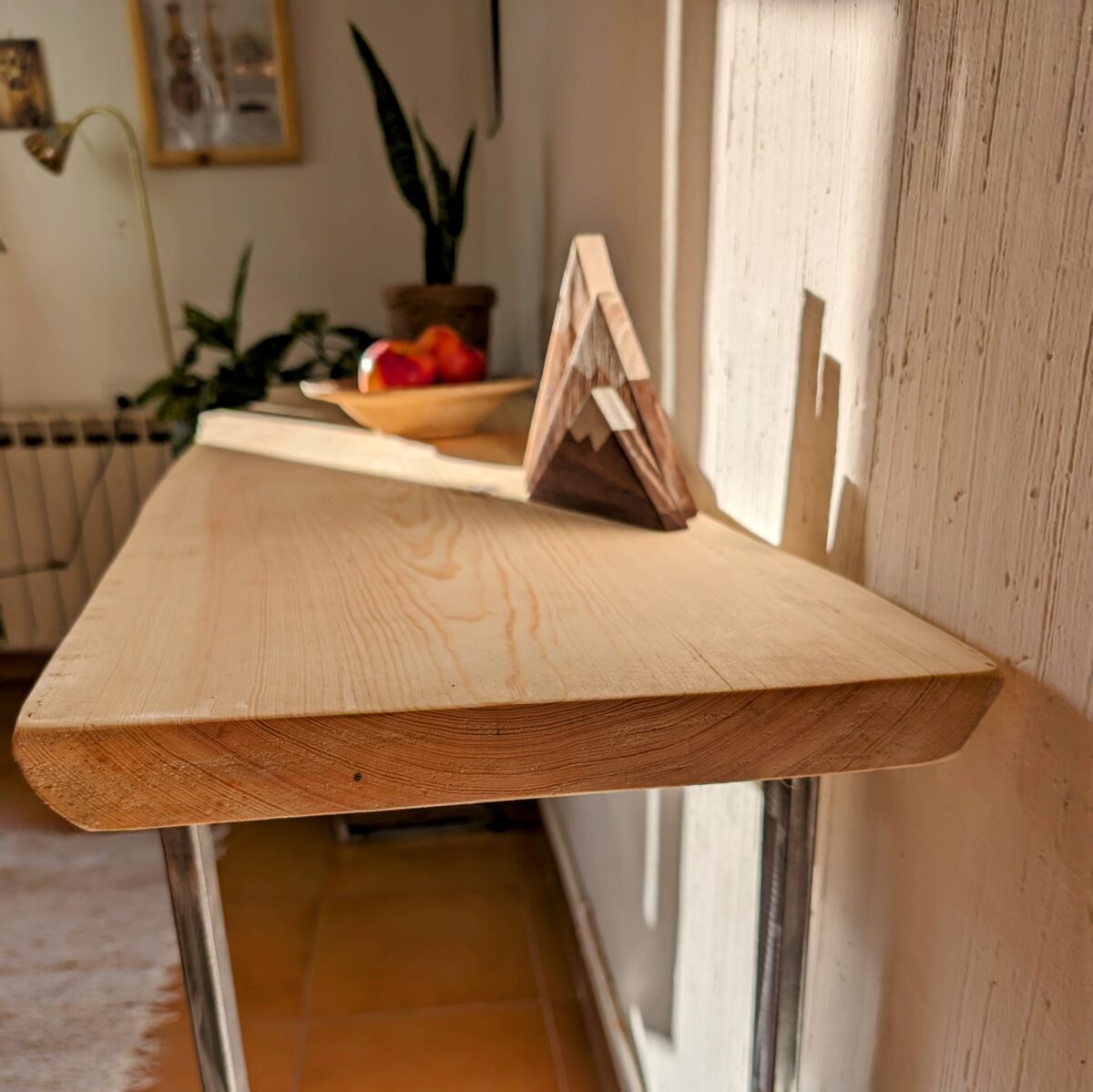 Console table with metal legs and live edge