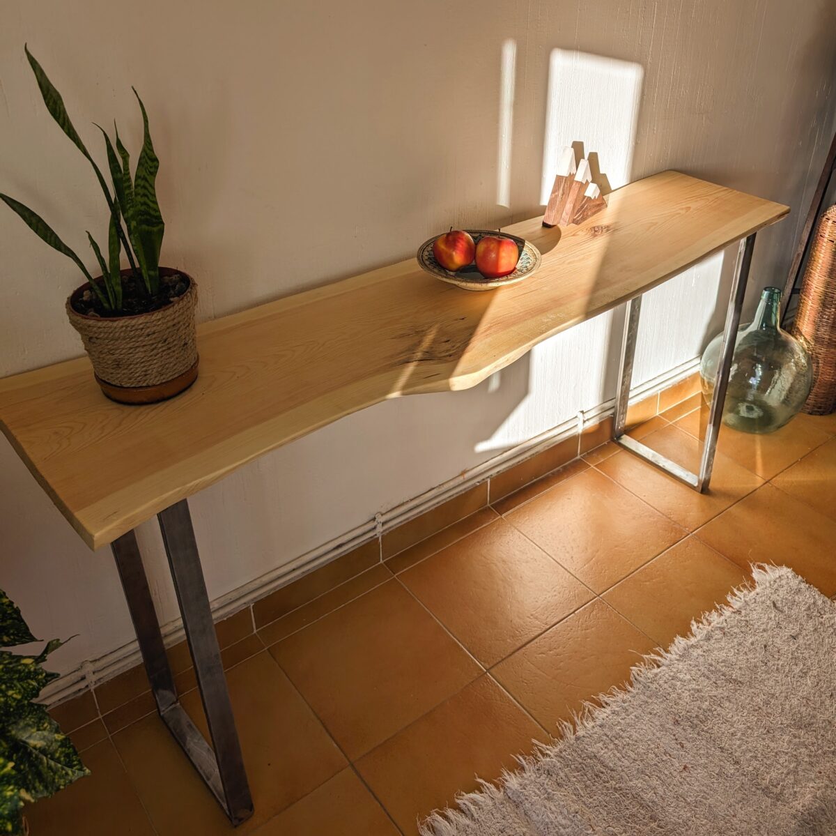 Console table with metal legs and live edge